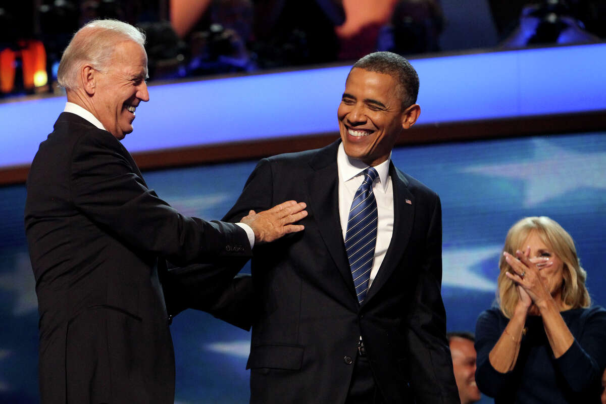 President Barack Obama and Vice President Joe Biden laugh after their embrace next to Jill Biden at the conclusion of the Democratic National Convention at Time Warner Cable Arena in Charlotte, NC on Thursday, Sept. 6, 2012.
