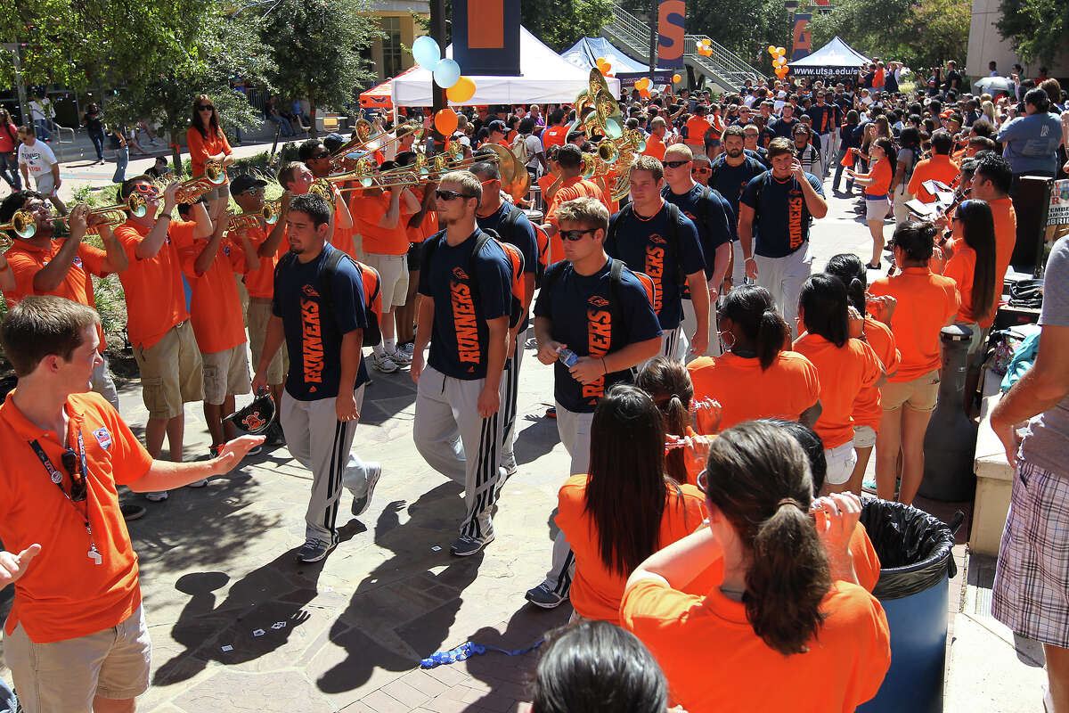 UTSA football players are cheered on by students during a rally for the team at the 1604 campus on Friday, Sept. 7, 2012. The university held their first on-campus rally for the team on the eve of their first home game of their second season.