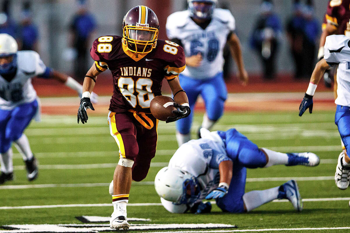Harlandale wide receiver James Mendoza breaks free for an 82-yard touchdown during the second quarter of their game with Lanier at Harlandale Memorial Stadium on Sept. 7, 2012. Harlandale won the game 58-16. MARVIN PFEIFFER/ mpfeiffer@express-news.net