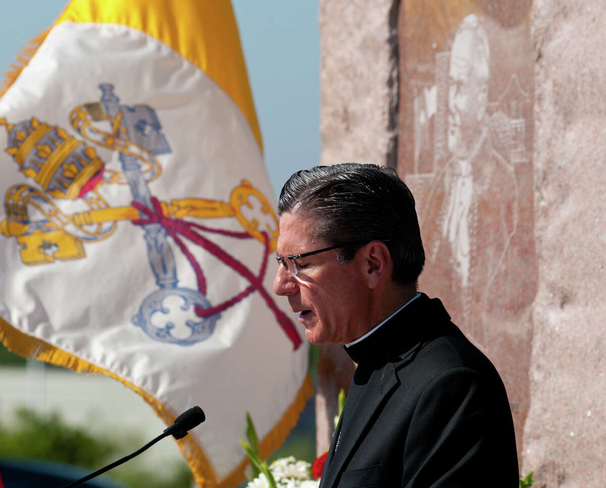 Archbishop Gustavo García-Siller prays at the end of a ceremony on Friday, Sept. 7, 2012, commemorating the 25th anniversary of Pope John Paul II's visit to San Antonio. The "Blessed John Paul II Monument" will now be near the corner of Potranco and Dugas, adjacent to Stevens High School.