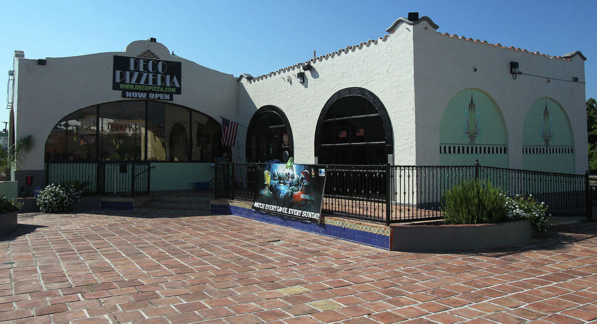 This is the Deco Pizzeria at 1815 Fredericksburg Road. The pizzeria's owner, Jacob Valenzuela, says the building awaits City Council action on historic landmark designation. A former 1938 gas station, the bulding resembles a mini Spanish mission and has an enclosed dining area where gas pumps once stood.