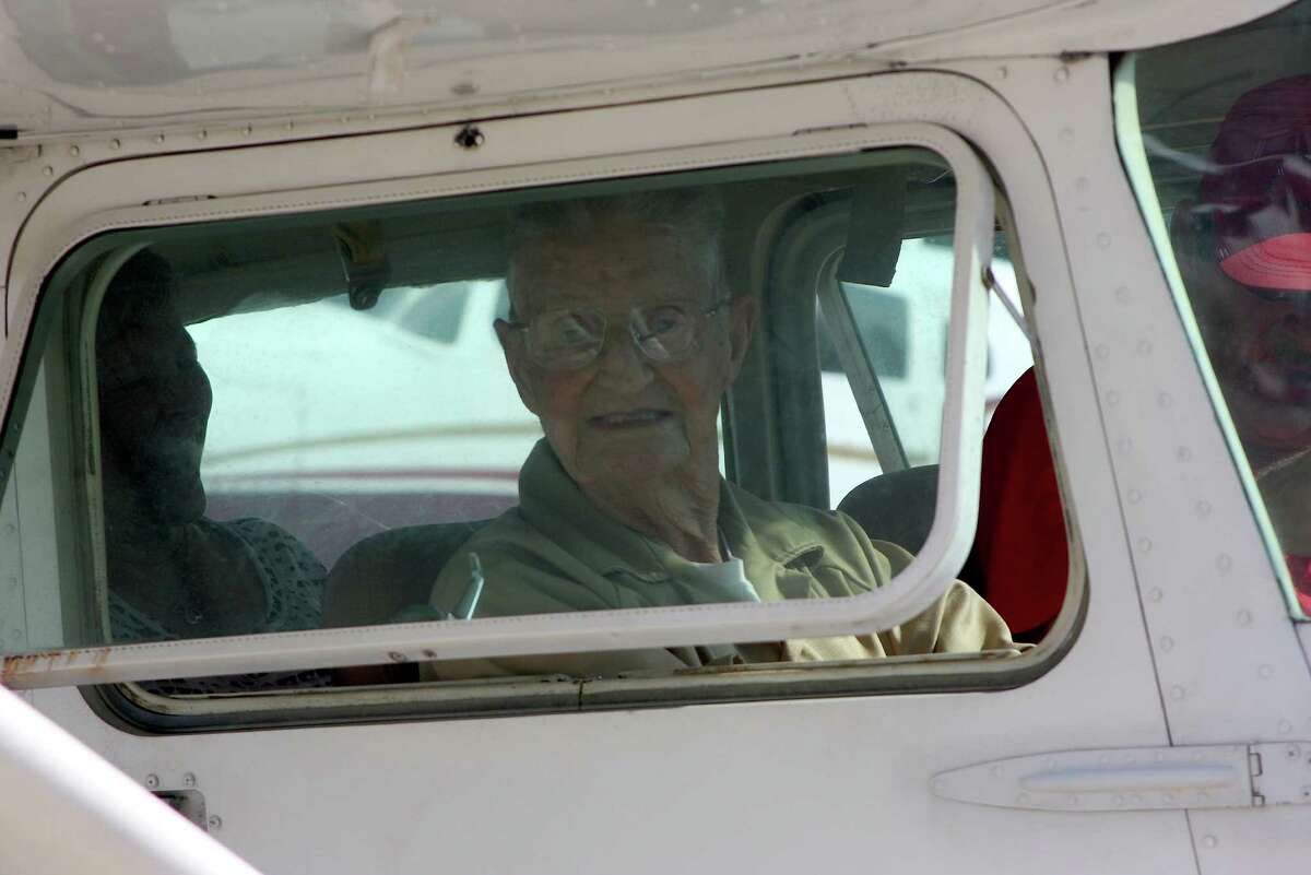 WWII veteran fighter pilot Verenon Knapp eagerly waits to get off the ground for the first time since 1989. The flight was Knapp's first since being grounded after logging approximately 30,000 hours at the controls.
