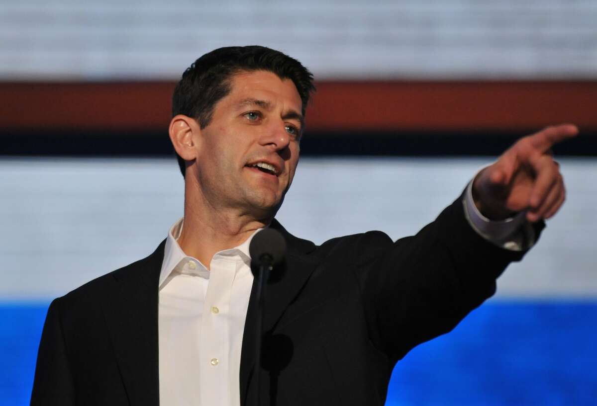 GOP Vice presidential nominee Paul Ryan points at something during a sound check at the Tampa Bay Times Forum in Tampa, Florida, on August 29, 2012 before the day's Republican National Convention (RNC) events. The RNC will culminate on August 30th with the formal nomination of Mitt Romney and Paul Ryan as the GOP presidential and vice-presidential candidates in the US presidential election. (Stan HONDASTAN HONDA/AFP/GettyImages) (STAN HONDA / AFP/Getty Images)