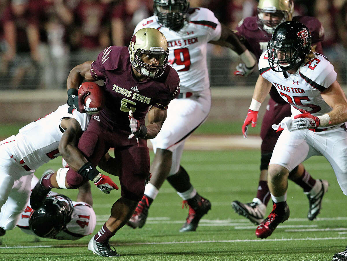 Isaiah Battle picks up some yards for the Bobcats in the second half as Texas State hosts Texas Tech at Bobcat Stadium on September 8, 2012.