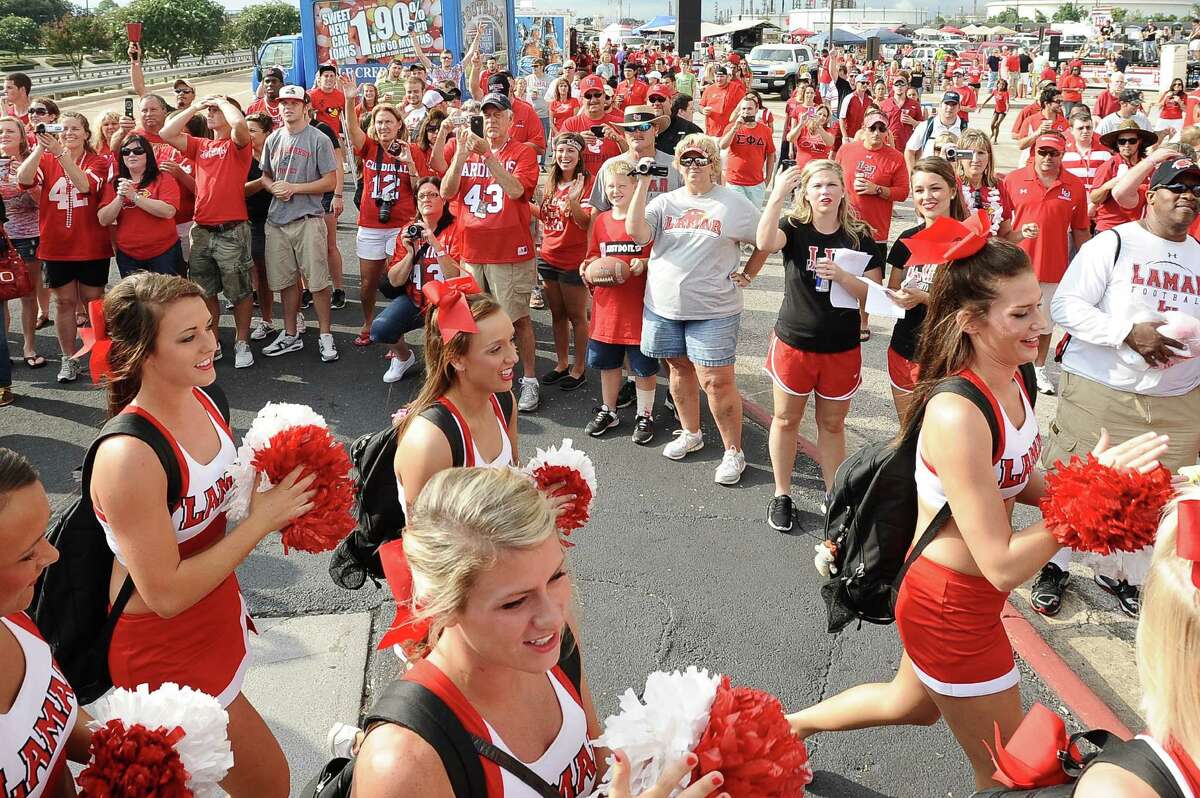 Lamar fans cheer on the team and cheerleaders as they make their way to Provost Umphrey Stadium on Saturday, September 8, 2012. Photo taken: Randy Edwards/The Enterprise
