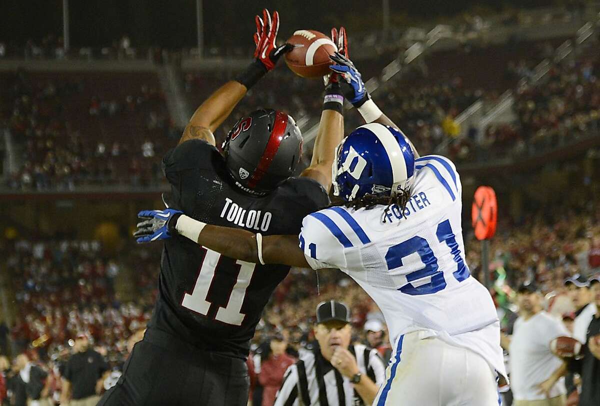 PALO ALTO, CA - SEPTEMBER 08: Levine Toilolo #11 of the Stanford Cardinals catches a three yard touchdown pass over Tony Foster #31 of the Duke Blue Devils during the third quarter of an NCAA football game at Stanford Stadium on September 8, 2012 in Palo Alto, California. (Photo by Thearon W. Henderson/Getty Images)