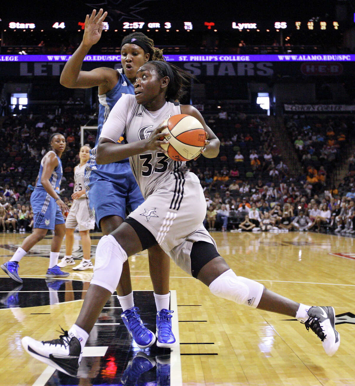 Silver Stars' Sophia Young looks for room around Lynx's Rebekkah Brunson during second half action Sunday Sept. 9, 2012 at the AT&T Center. The Lynx won 81-62.