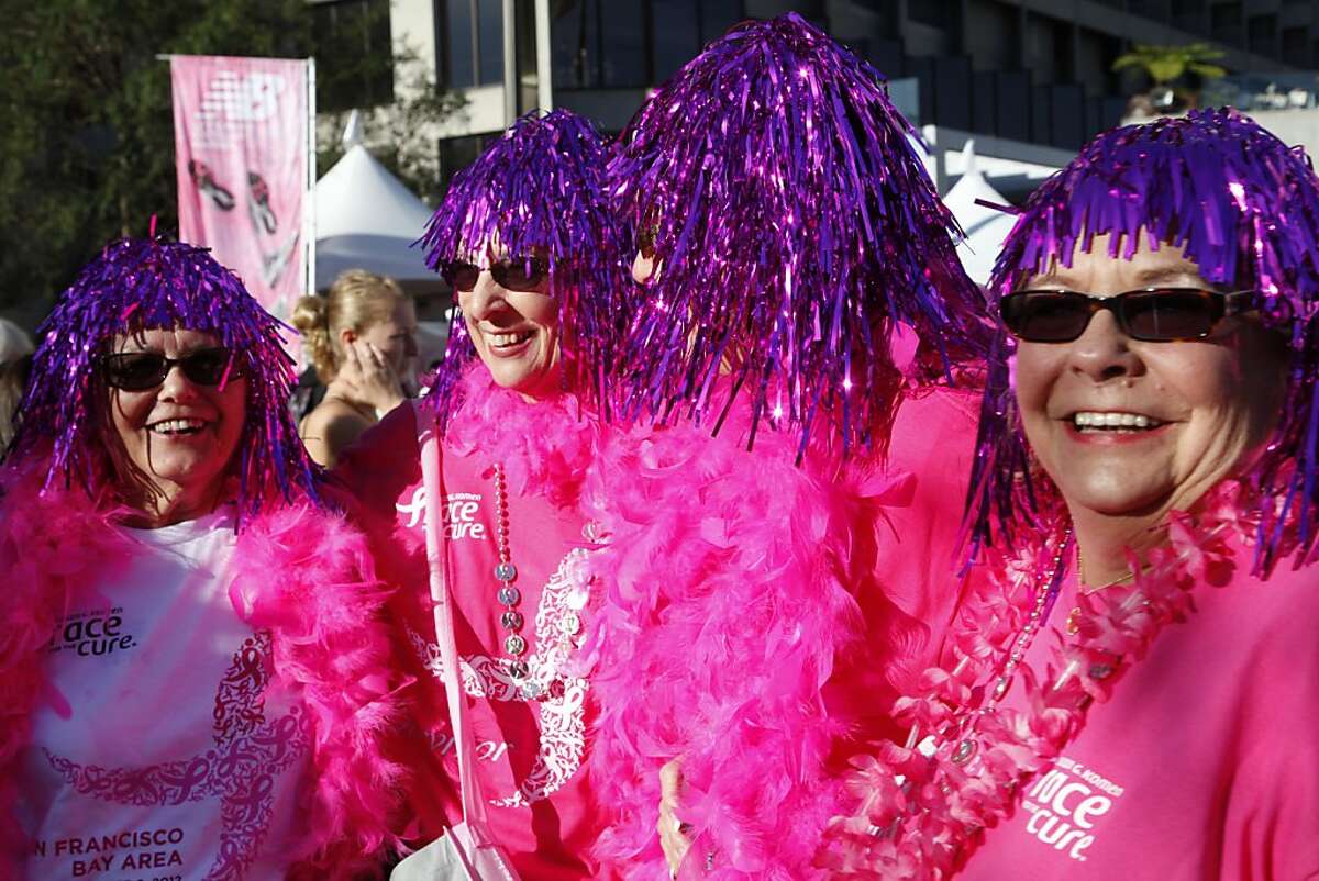 Breast cancer survivors Gloria West, Cheryl Griess, Faye Trask and Glenda Guthart (left to right) laugh together before the start of the Susan G. Komen 22nd Annual Race For The Cure in San Francisco Calif. on Sunday, Sept. 9, 2012. West and Guthart (twins) lost their mother to breast cancer and are now annual participants in the Susan G. Komen event.