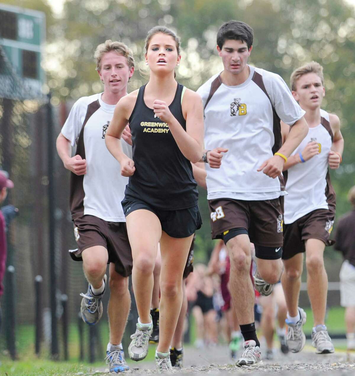 Greenwich Academy cross country coaches Jane Finch and Jon Coffin are expecting big things this year from returning runner Annie Duff.