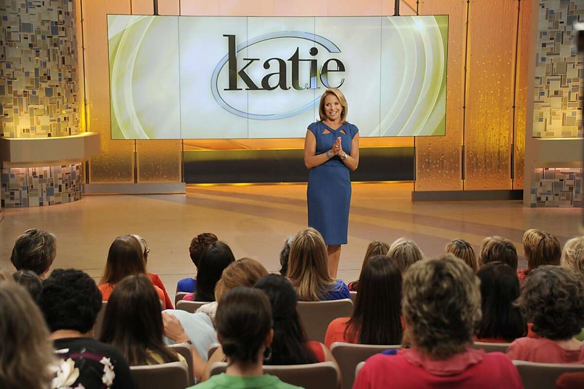 This image released by ABC shows host Katie Couric making her debut appearance for her syndicated talk show "Katie," Monday, Sept. 10, 2012 in New York. (AP Photo/Disney-ABC Domestic Television, Ida Mae Astute)