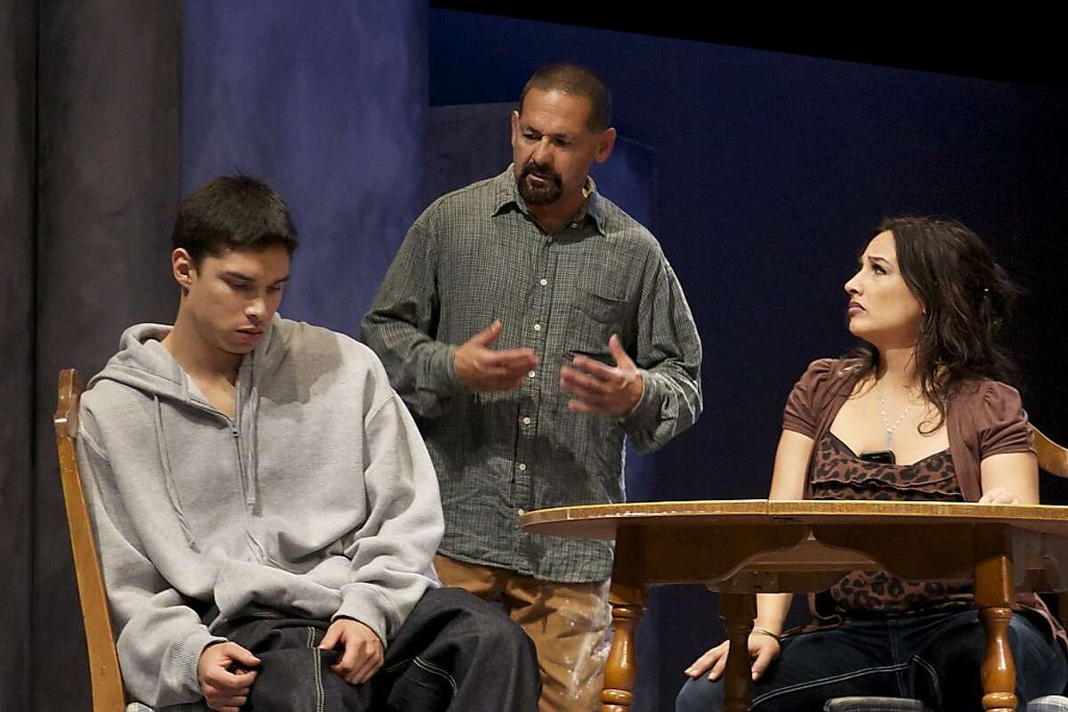Fausto (Ric Salinas, center), an ex-con former gang member, and his ex-partner Claudia (Cristina Frias, right) try to steer their son Edgar (Ricky Saenz) away from gang life in the Mission in the world premiere of Paul Flores' "Placas"
