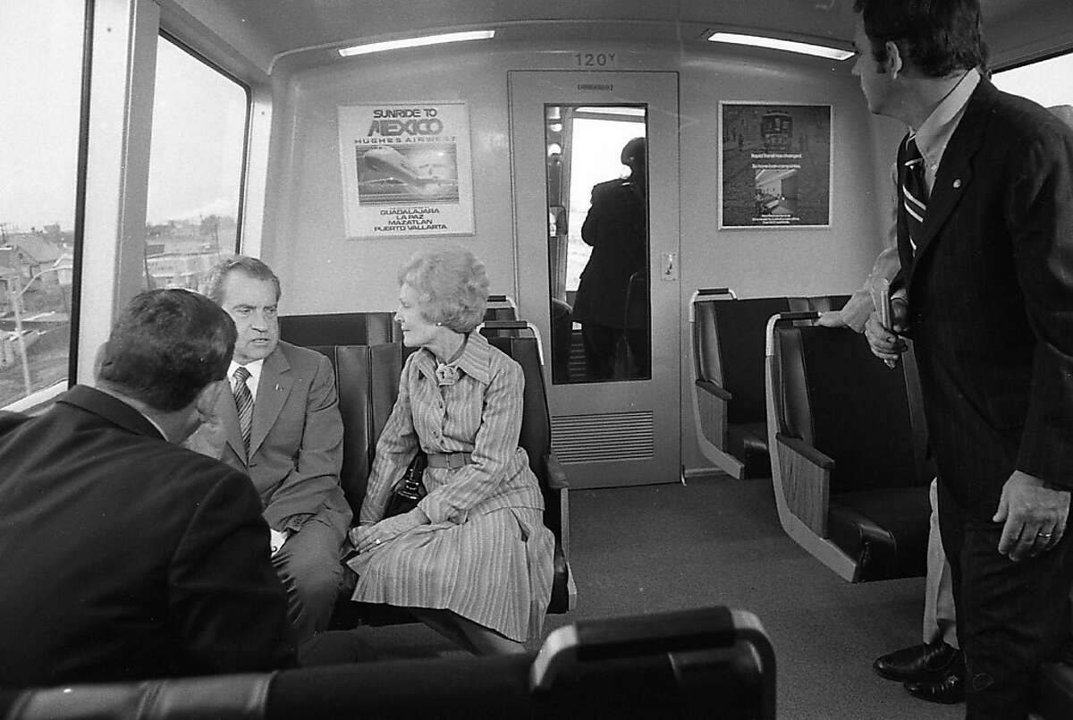 A wider shot of Richard Nixon and his wife Pat during a November 1972 trip on BART.