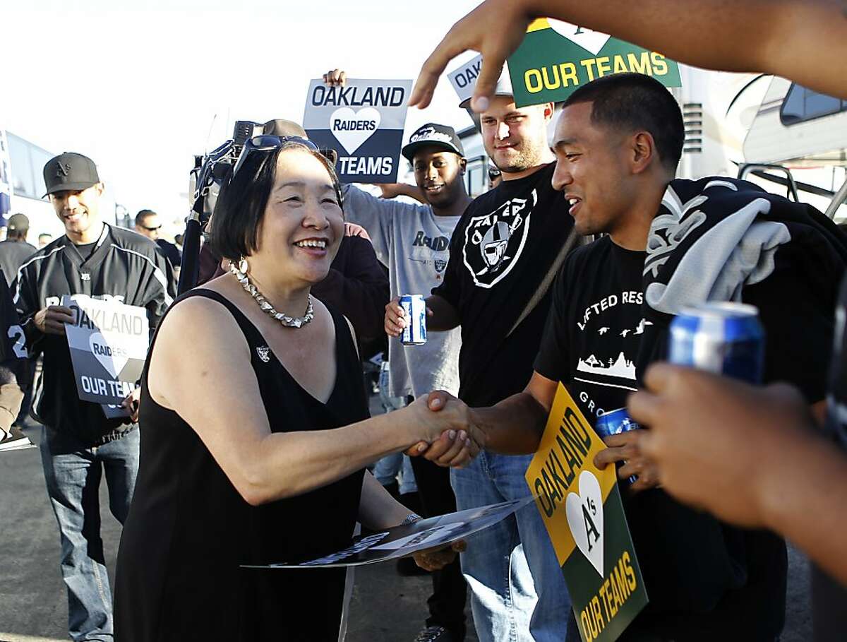 Mayor Jean Quan greets Oakland Raiders fans before the game against the San Diego Chargers in Oakland, Calif. on Monday, Sept. 10, 2012.