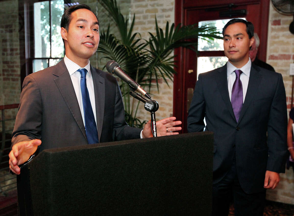 Mayor Julian Castro (left) speaks as his twin brother congressional candidate Joaquin Castro listens during a fund-raiser for Joaquin held Monday Sept. 10, 2012 at Ruth's Chris Steak House.