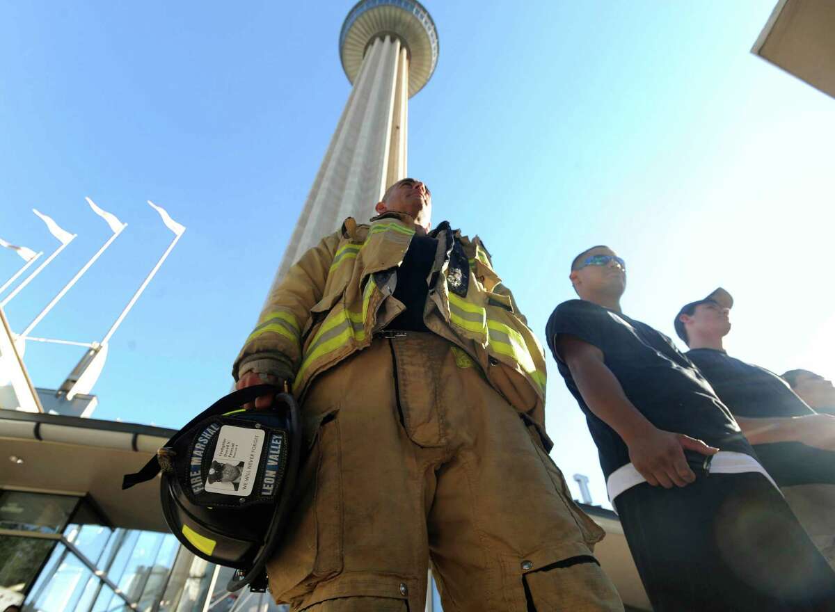 Fire Marshal Luis Valdez of Leon Valley stands by the Tower of the Americas that he and others climbed in September. Climb the tower this weekend to benefit the Cystic Fibrosis Foundation.