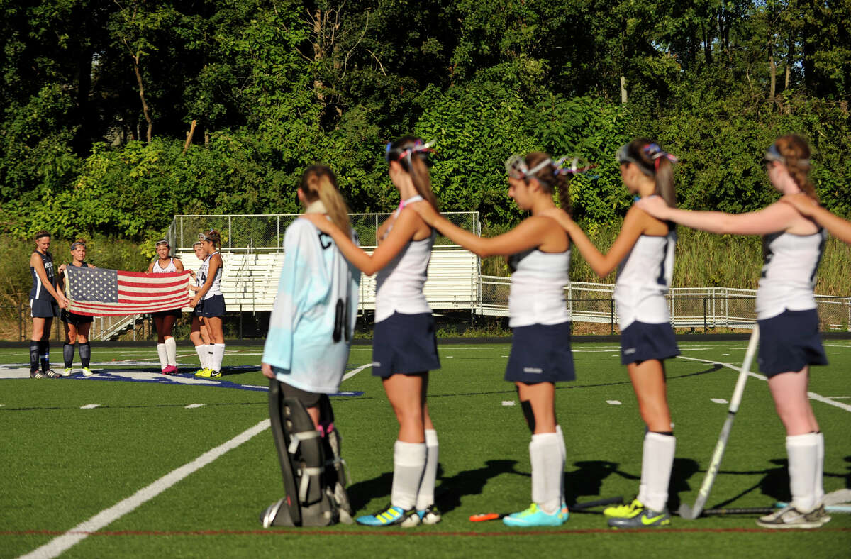 Immaculate High School field hockey players remember Candace Williams during a ceremony before their game against Morgan of Clinton at Immaculate High School in Danbury on Tuesday, Sept. 11, 2012. Williams was a victim in the terrorist attacks of 9/11.