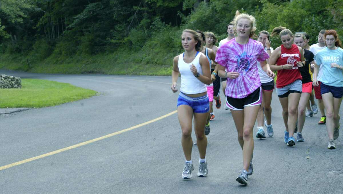 Kelsey Hall, left,and Clara Wolfe set the pace as the Shepaug Valley High School girls' cross country team gears up for the Berkshire League campaign. September 2012