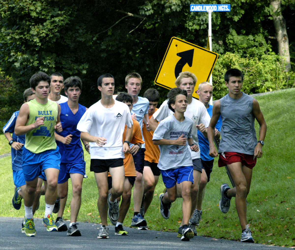 Ryan Clarke, right, and Greg Hansell set the pace as the lead pack of New Milford High School HIgh School's potentially strong boys' cross country team cruises Candlewood Lake Road during a pre-seasonm workout. September 2012