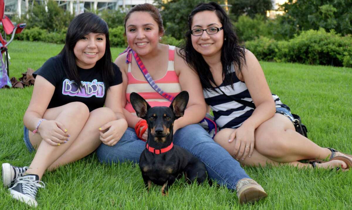 Evelin, from left, Pavi and Elii De La Rosa with Rocko