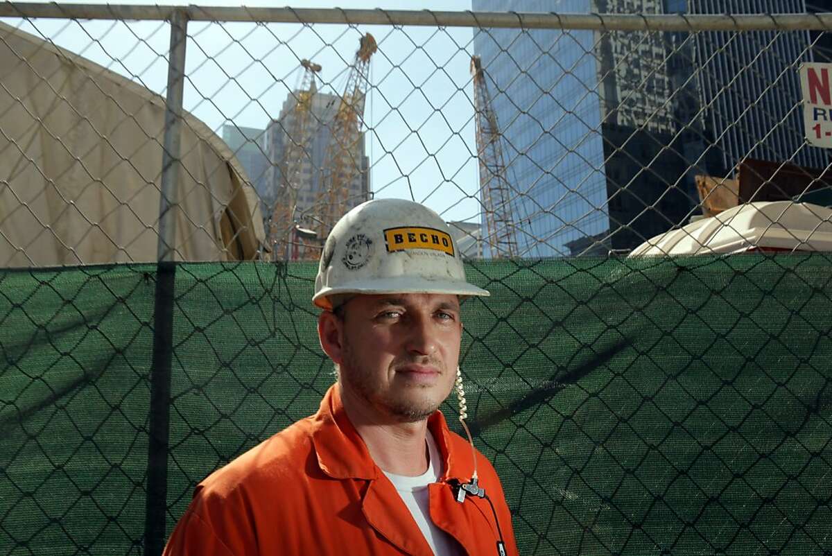 Crane operator Brandon Valasik poses on Wednesday, September 12, 2012, in San Francisco, Calif., at the site of the Transbay Terminal where he unearthed parts of the remains of a wooly mammoth.