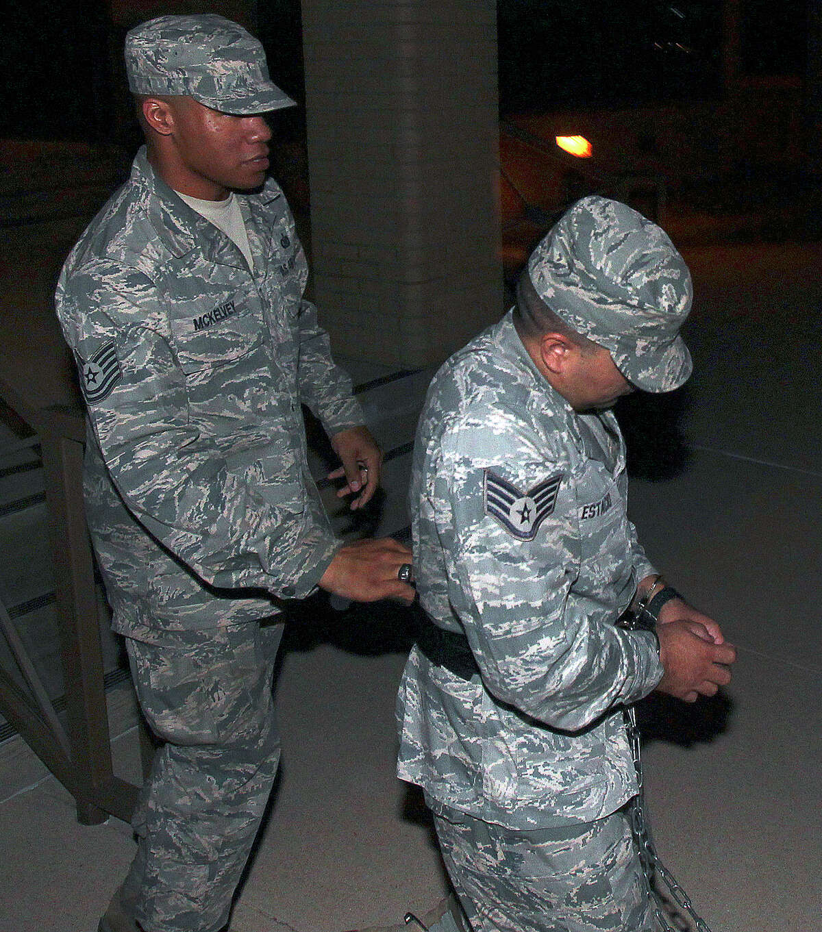 Staff Sgt. Kwinton Estacio is led away from the 37th Training Wing Headquarters after sentencing in his trial at Joint Base San Antonio-Lackland on September 12, 2012.