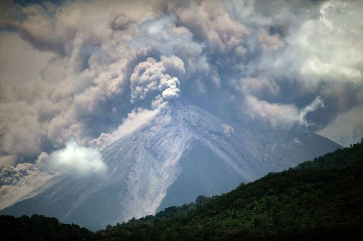 Towering plumes of smoke rise from the Volcano of Fire as it spews lava and ash seen from Palin, south of Guatemala City. The national disaster agency said "a massive evacuation of thousands" was under way.