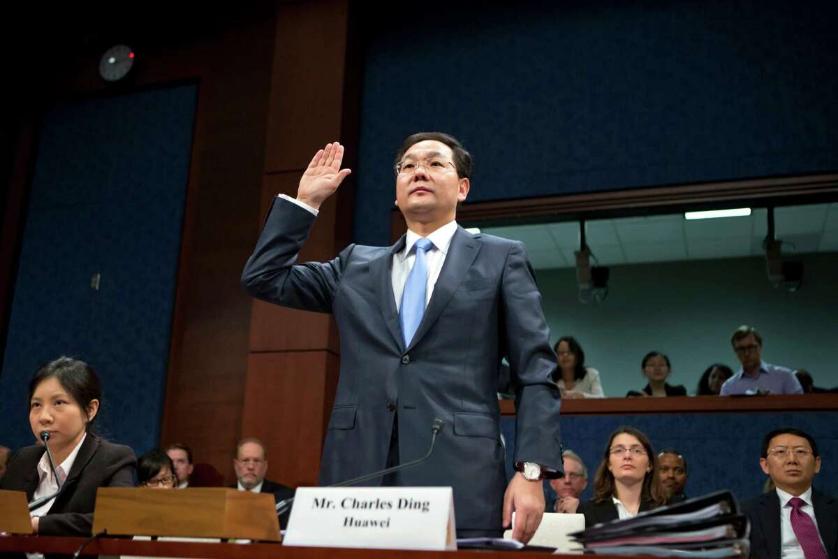 Charles Ding, Huawei Technologies Ltd's senior vice president for the U.S., is sworn in on Capitol Hill in Washington, Thursday, Sept. 13, 2012, prior to testifying before the House Intelligence Committee as lawmakers probe whether Chinese tech giants' expansion in the U.S. market pose a threat to national security. (AP Photo/J. Scott Applewhite)