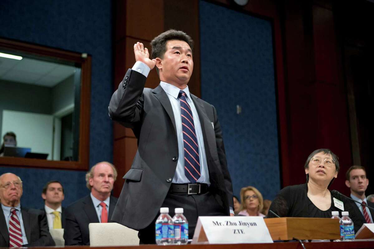 Zhu Jinyun, ZTE Corporation's senior vice president for North America and Europe, is sworn in on Capitol Hill in Washington, Thursday, Sept. 13, 2012, prior to testifying before the House Intelligence Committee as lawmakers probe whether Chinese tech giants' expansion in the U.S. market pose a threat to national security. (AP Photo/J. Scott Applewhite)