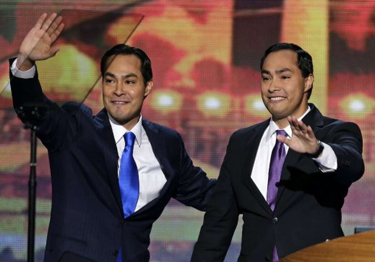 San Antonio Mayor Julian Castro and his brother Joaquin Castro, right, wave to the Democratic National Convention in Charlotte, N.C., on Tuesday, Sept. 4, 2012. (AP Photo/J. Scott Applewhite) (J. Scott Applewhite / Associated Press)
