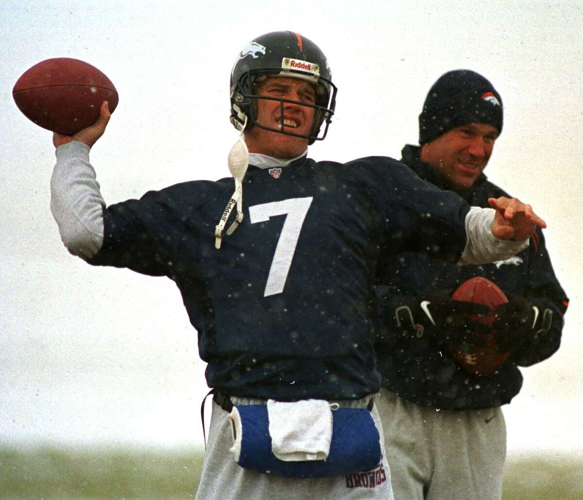 If anyone knows what an elite quarterback-running back-wide receiver combo can mean to a team, it is Texans coach Gary Kubiak, right, who tutored John Elway (7), Terrell Davis and Shannon Sharpe at Denver.