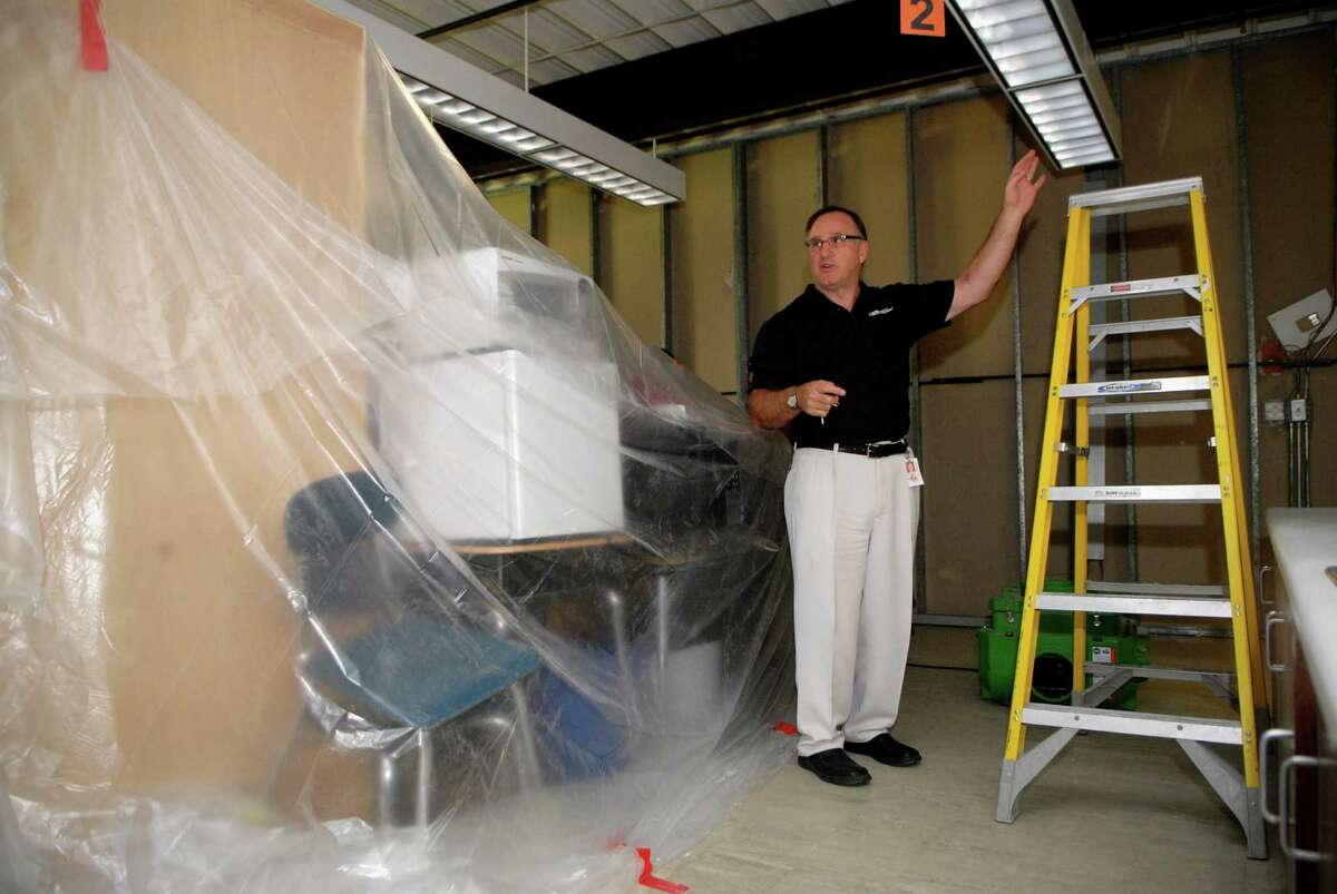 Al Barbarotta, facilities director for the board of education, shows where the water damage is being repaired at Toquam Magnet School in Stamford, Conn. on Friday September 14, 2012.