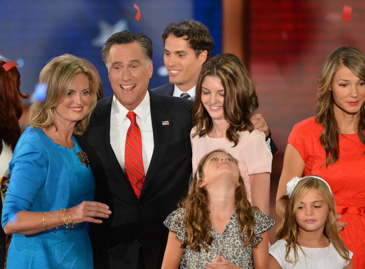 Republican presidential candidate Mitt Romney hugs family members following his acceptance speech at the Tampa Bay Times Forum in Tampa, Florida, on August 30, 2012 on the final day of the Republican National Convention (RNC). The RNC culminates today with the formal nomination of Mitt Romney and Paul Ryan as the GOP presidential and vice-presidential candidates in the US presidential election. (STAN HONDA / AFP/Getty Images)