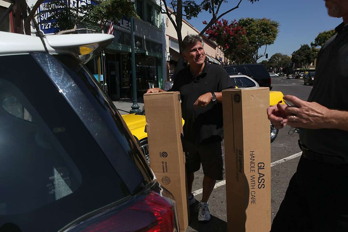 Past TV reporter news anchor Jim Wieder owns and manages Ace Hardware in Hayward, Calif., as he helps a customer load his car on Wednesday, September 12, 2012.