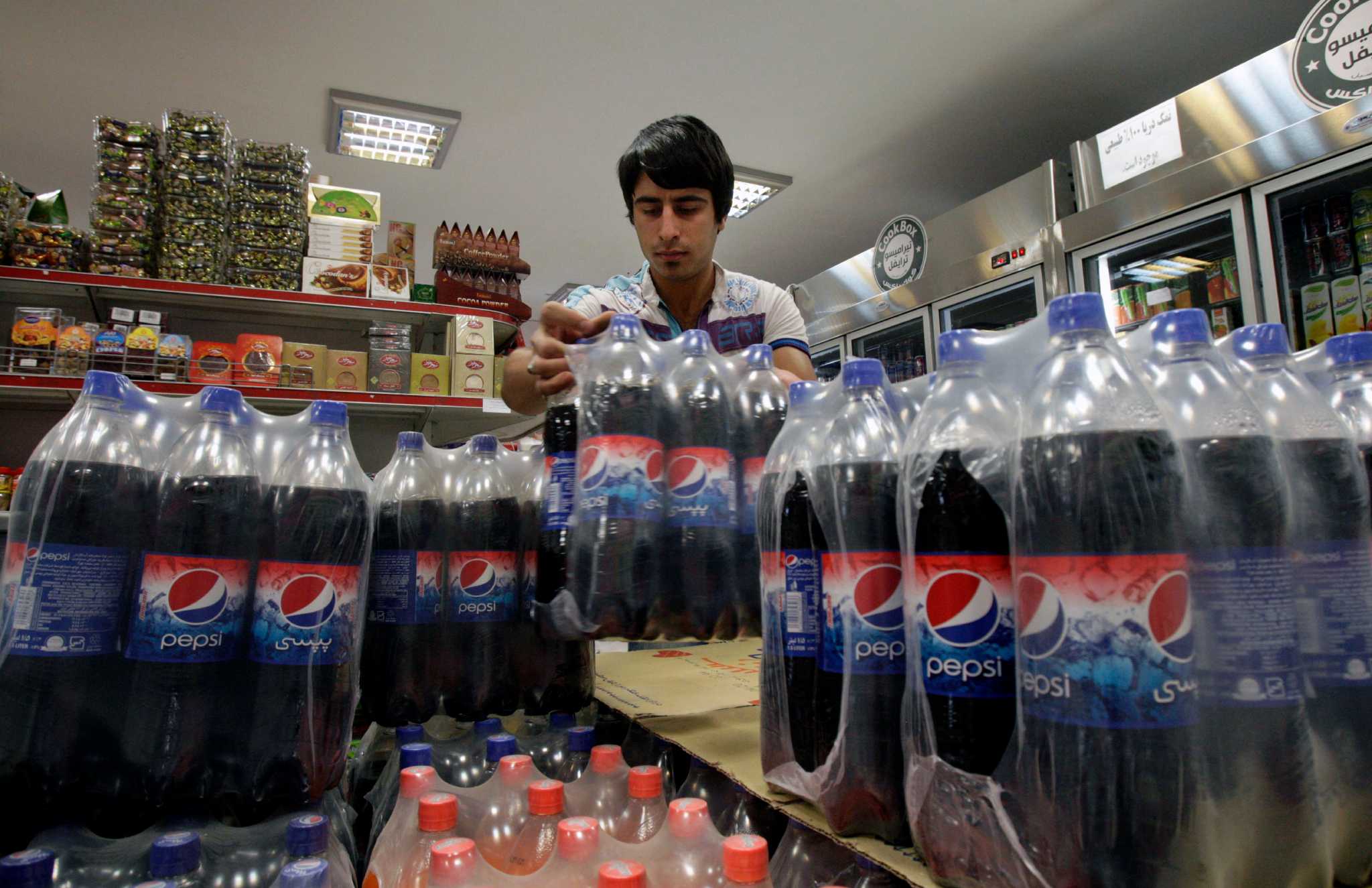 Coke Razor Buying American in Tehran: Apples, razors and Coke