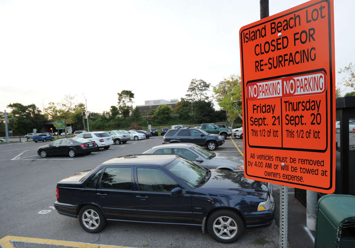 A sign posted in the Island Beach parking lot in Greenwich, Friday Sept. 14, 2012, informs vehicle owners that half of the lot will be closed for re-surfacing on Sept. 20-21.