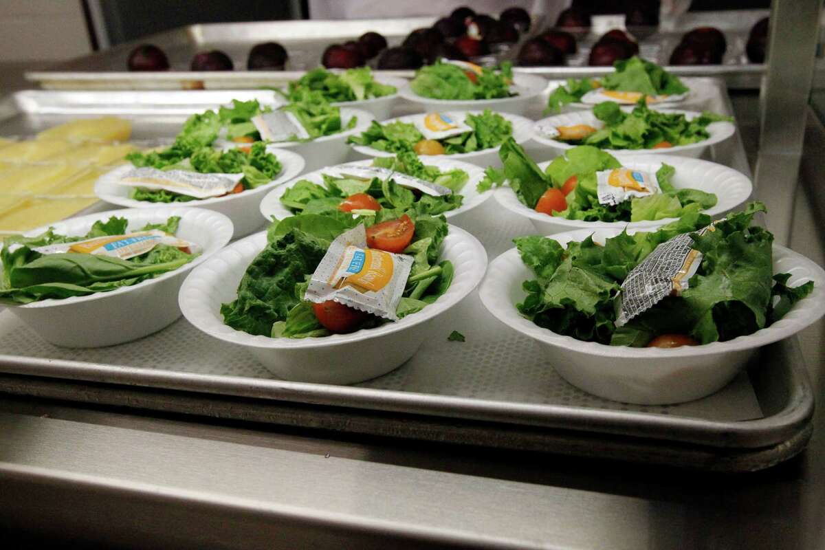 Side salads await the students of Eastside Elementary School in Clinton, Miss., Wednesday, Sept. 12, 2012. Much consideration goes into the planning of these school children's lunches. The leaner, greener school lunches served under new federal standards are getting mixed grades from students. (AP Photo/Rogelio V. Solis)