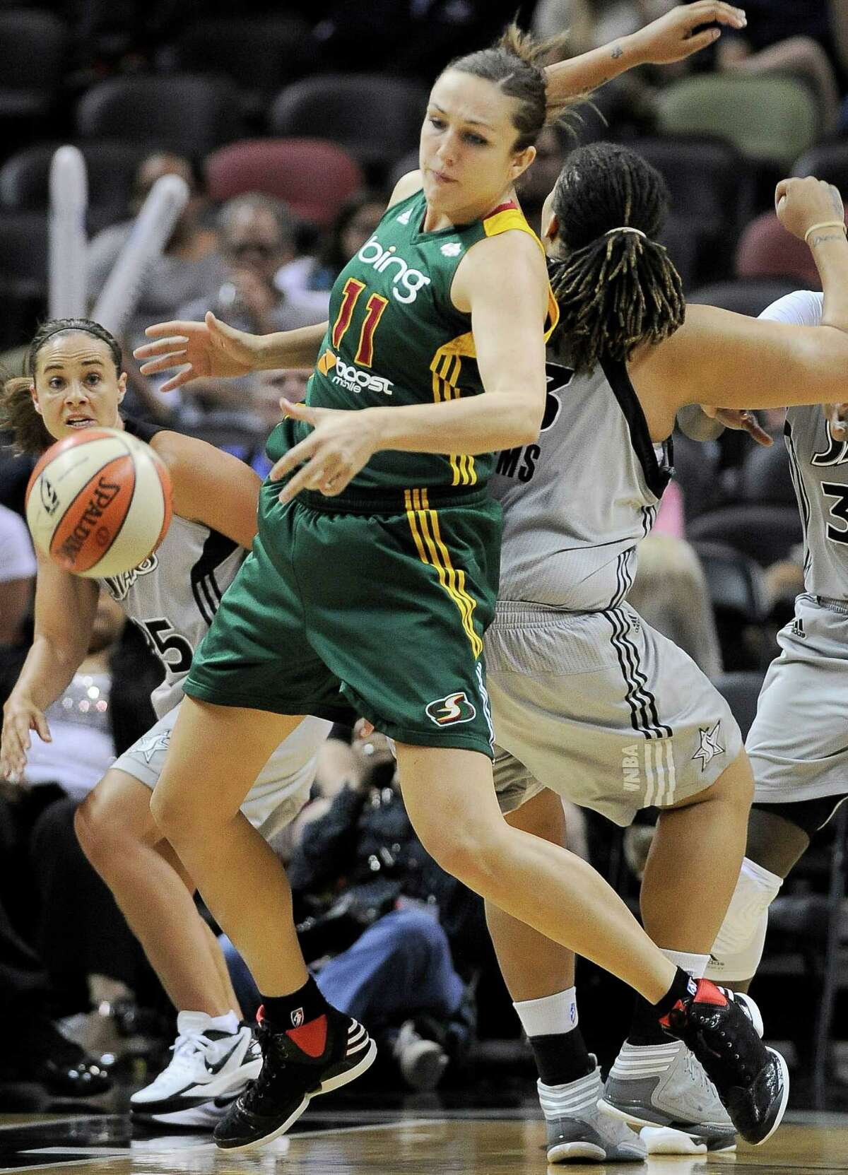 Seattle Storm's Ewelina Kobryn (11), of Poland, collides with San Antonio Silver Stars' Danielle Adams during the second half of a WNBA basketball game, Friday Sept. 14, 2012, in San Antonio. San Antonio won 90-66.