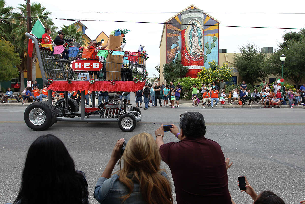 An enormous motorized H-E-B shopping cart lumbers along the parade route at the 31st Annual 16 de Septiembre Parade hosted by Avenida Guadalupe Association on Saturday, Sept. 15, 2012. Parade goers gathered to see nearly 40 floats joined high school marching bands and drill teams along the route to celebrate Mexico's independence from Spain.