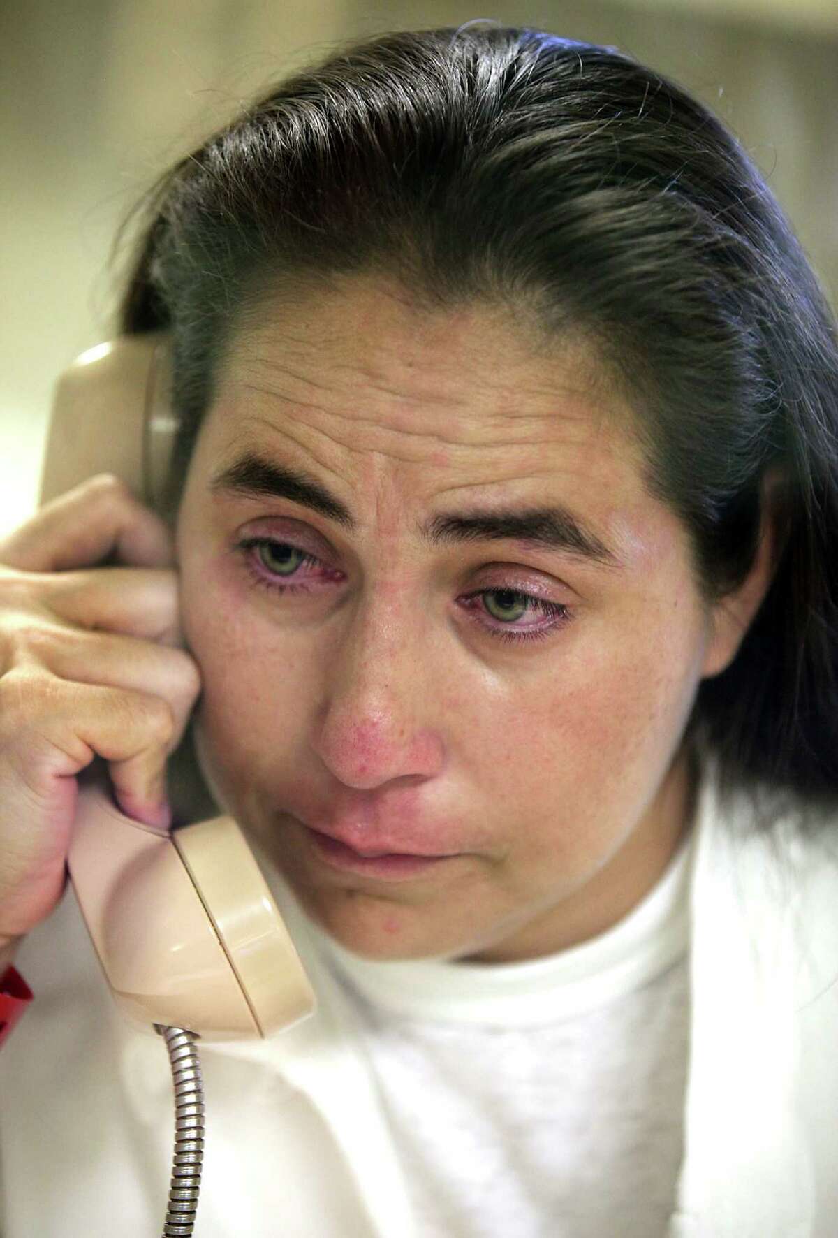 A tearful Anna Vasquez, 37, who was accused in 1994 of aggravated sexual assault of a child, speaks on a phone during a prison interview. She is incarcerated at the Murray Unit, in Gatesville, TX. Tuesday September 4, 2012.