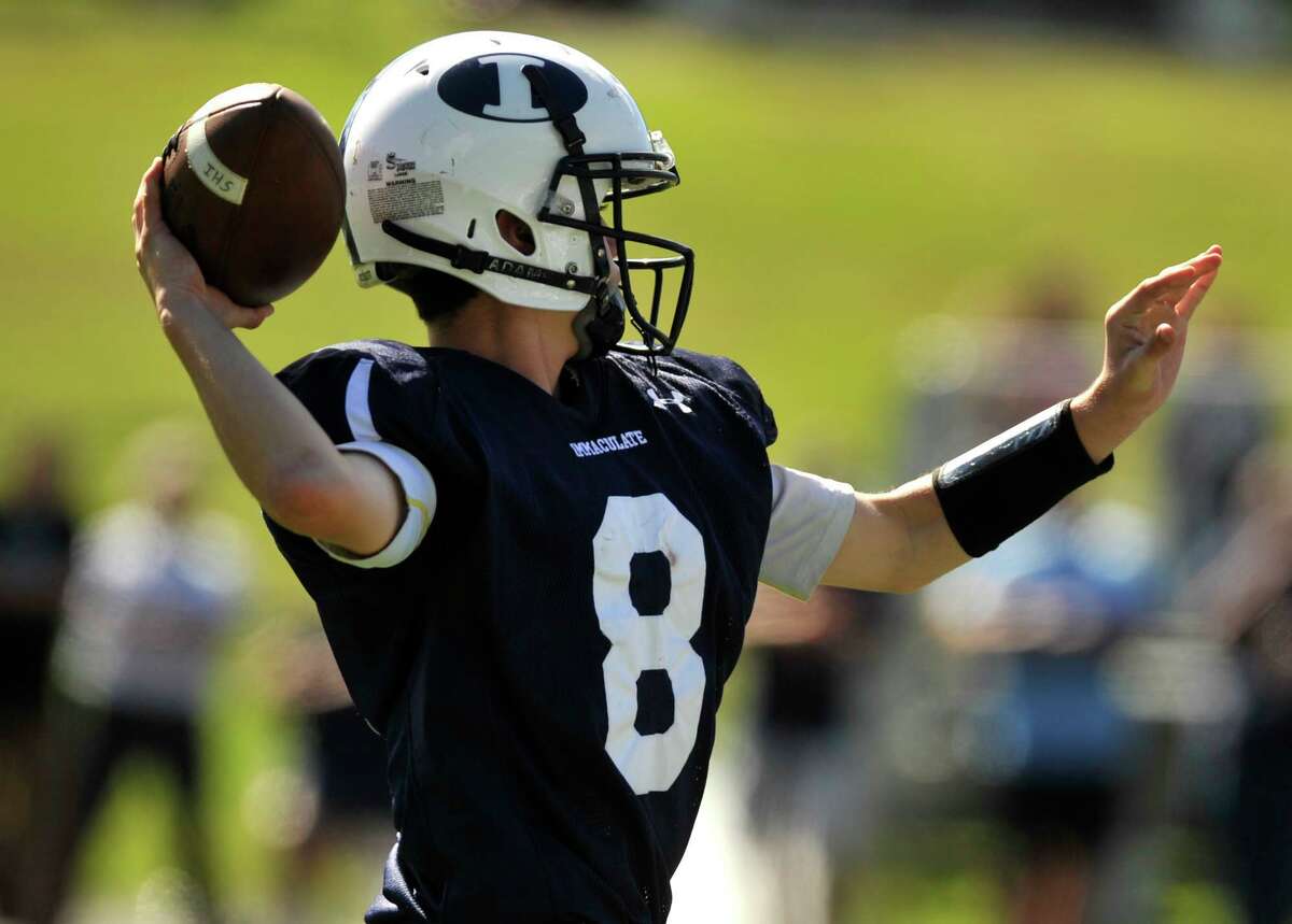 Immaculate quarterback Matthew Ryan readies to throw during their game against Oxford at Immaculate High School in Danbury on Saturday, Sept. 15, 2012. Oxford won, 35-0.