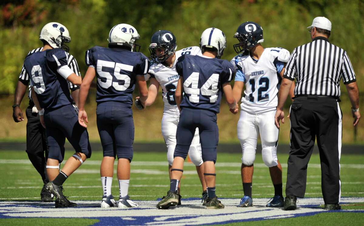 Oxford football team honors fallen teammate with seasonopening victory
