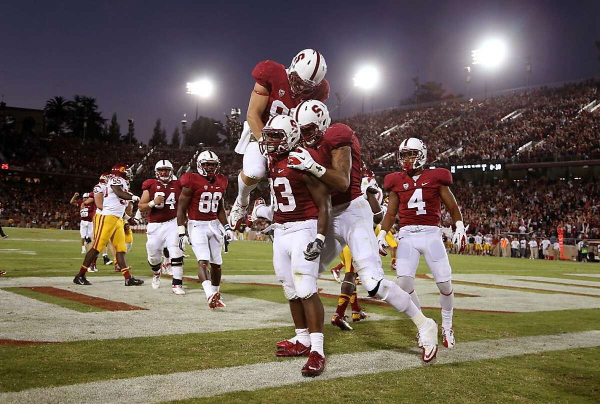 PALO ALTO, CA - SEPTEMBER 15: Stepfan Taylor #33 of the Stanford Cardinal is congratulated by teammates after he ran in for a touchdown against the USC Trojans at Stanford Stadium on September 15, 2012 in Palo Alto, California. (Photo by Ezra Shaw/Getty Images)