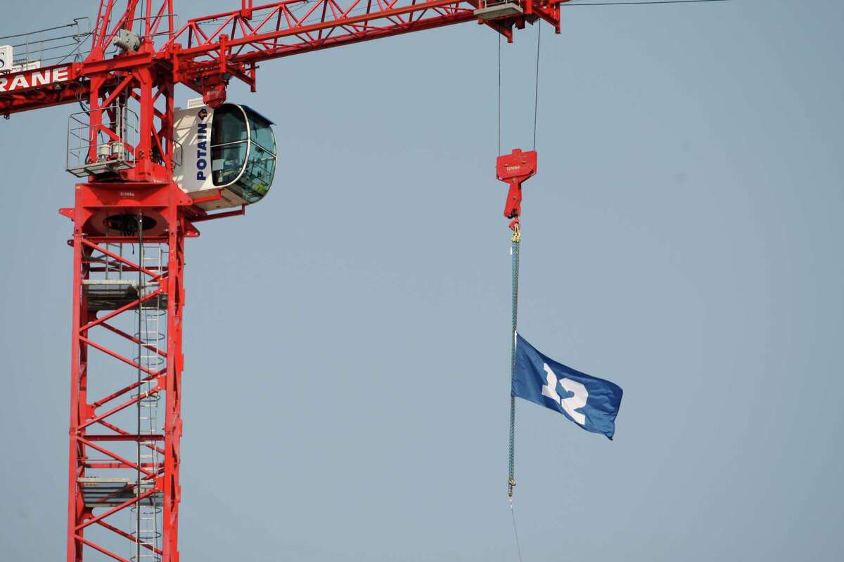 A fan "12th Man" flag flies outside the stadium before the NFL football game between the Dallas Cowboys and Seattle Seahawks, Sunday, Sept. 16, 2012, in Seattle.