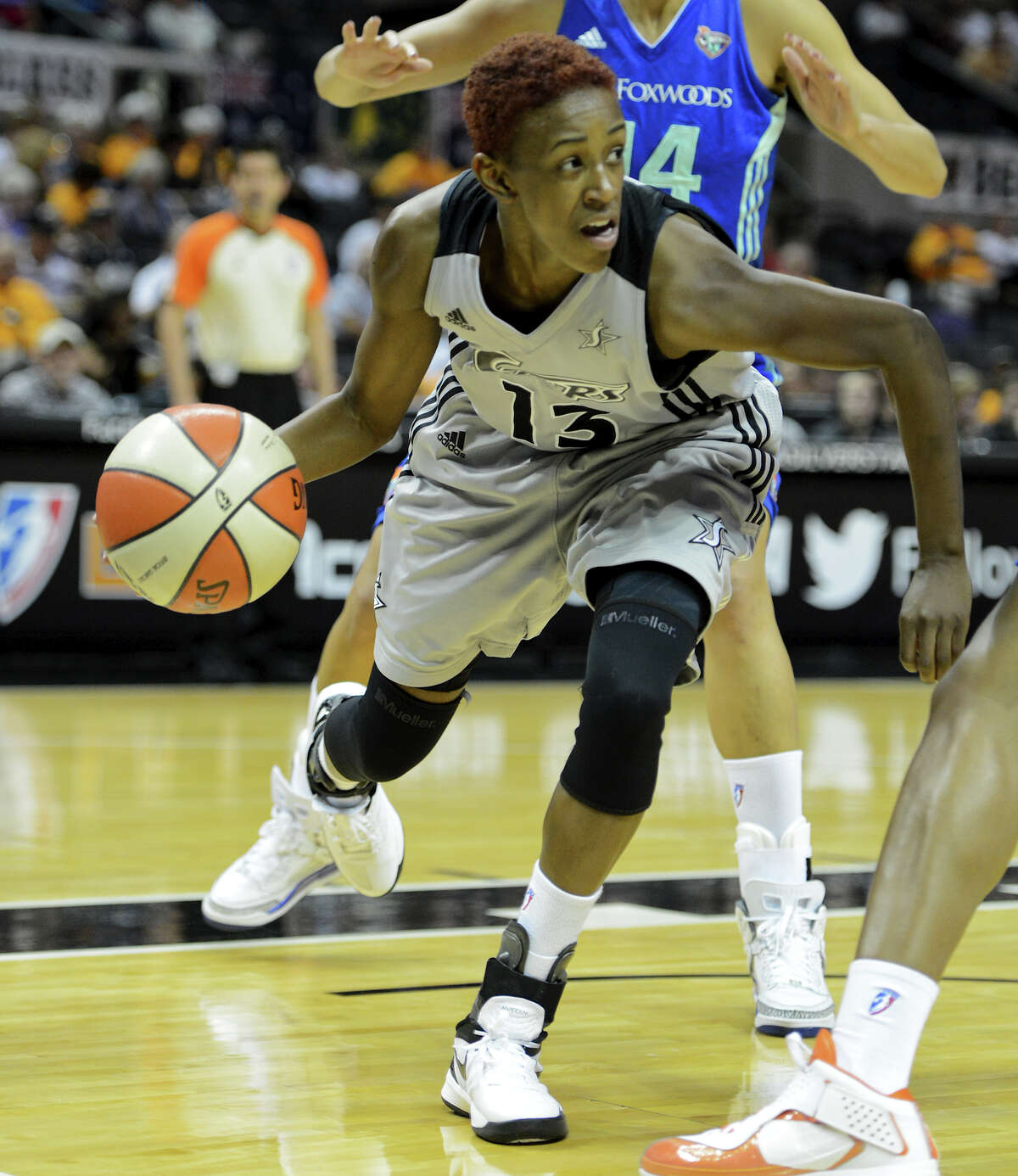 The Silver Stars' Daniell Robinson (13) looks to make a pass from under the buck during a WNBA game between the San Antonio Silver Stars and the New York Liberty on Tuesday, Sept. 18, 2012, at the AT&T Center.