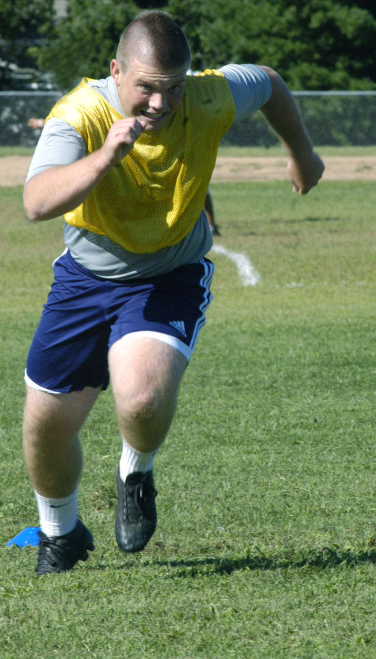 The Green Wave's Ben Bayers gives 100 percent during a testing pre-season fitness drill for New Milford High School boys' soccer, September 2012