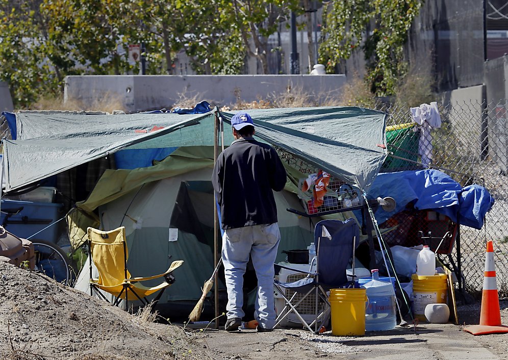 Fire fuels fear as homeless rebuild camp