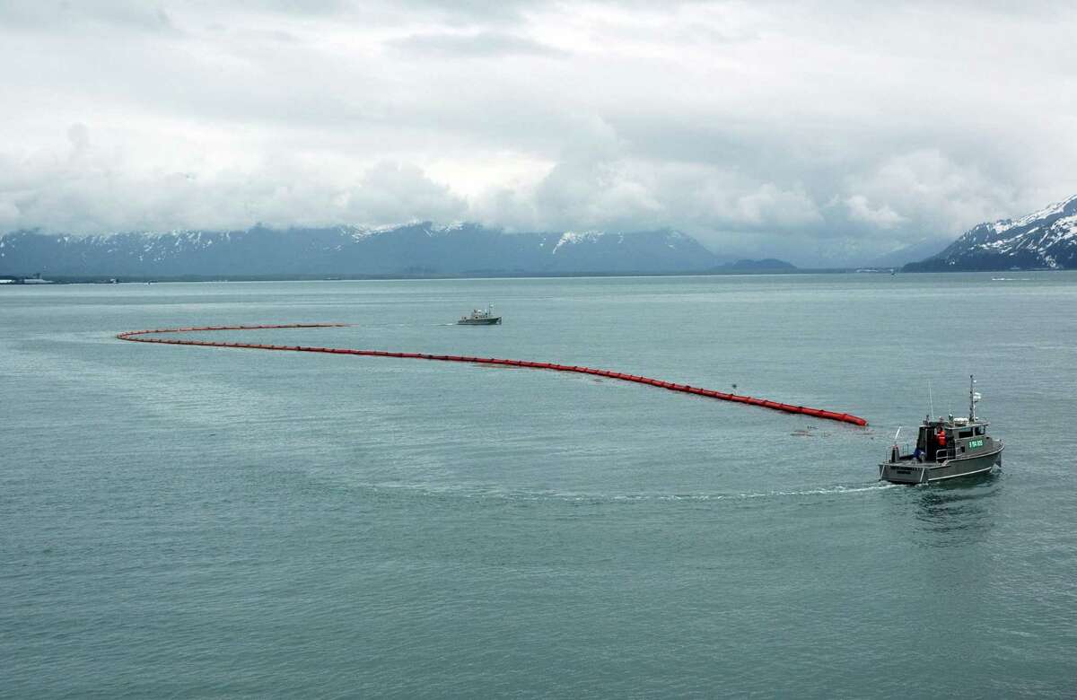 Inflatable boom stretches between oil spill response ships during training in Alaska. Shell has received the OK for initial Beaufort Sea drilling operations.