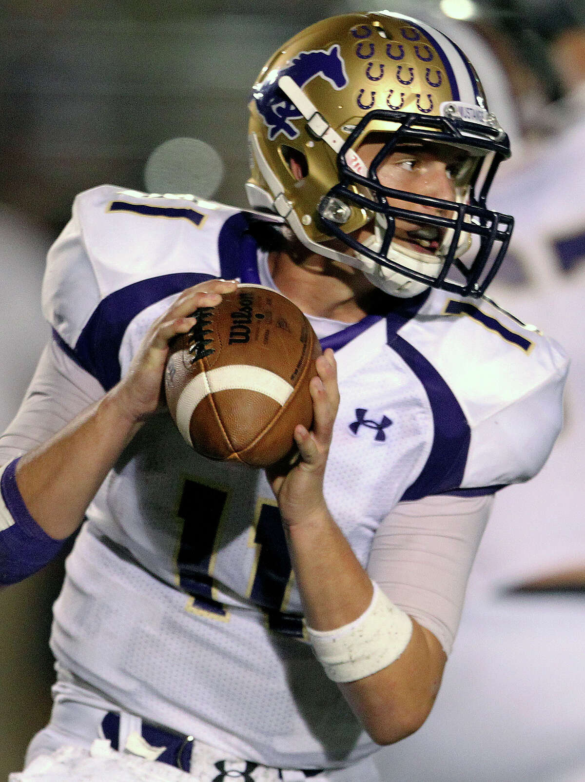 Mustang quarterback Mike Richardson waits for his receiver to streak toward the end zone as Champion hosts Marble Falls at Boerne Stadium on September 20, 2012.