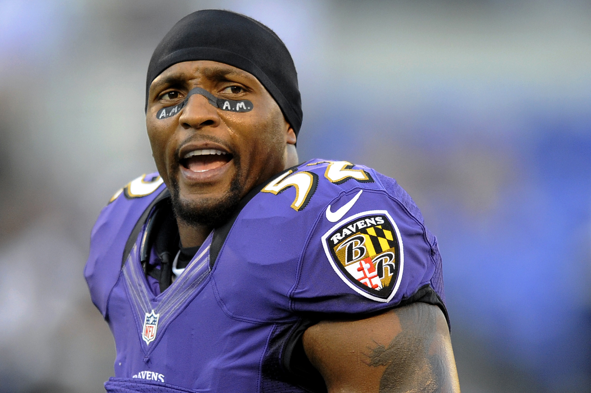 Former Baltimore Raven, Ray Lewis poses with his bust after his