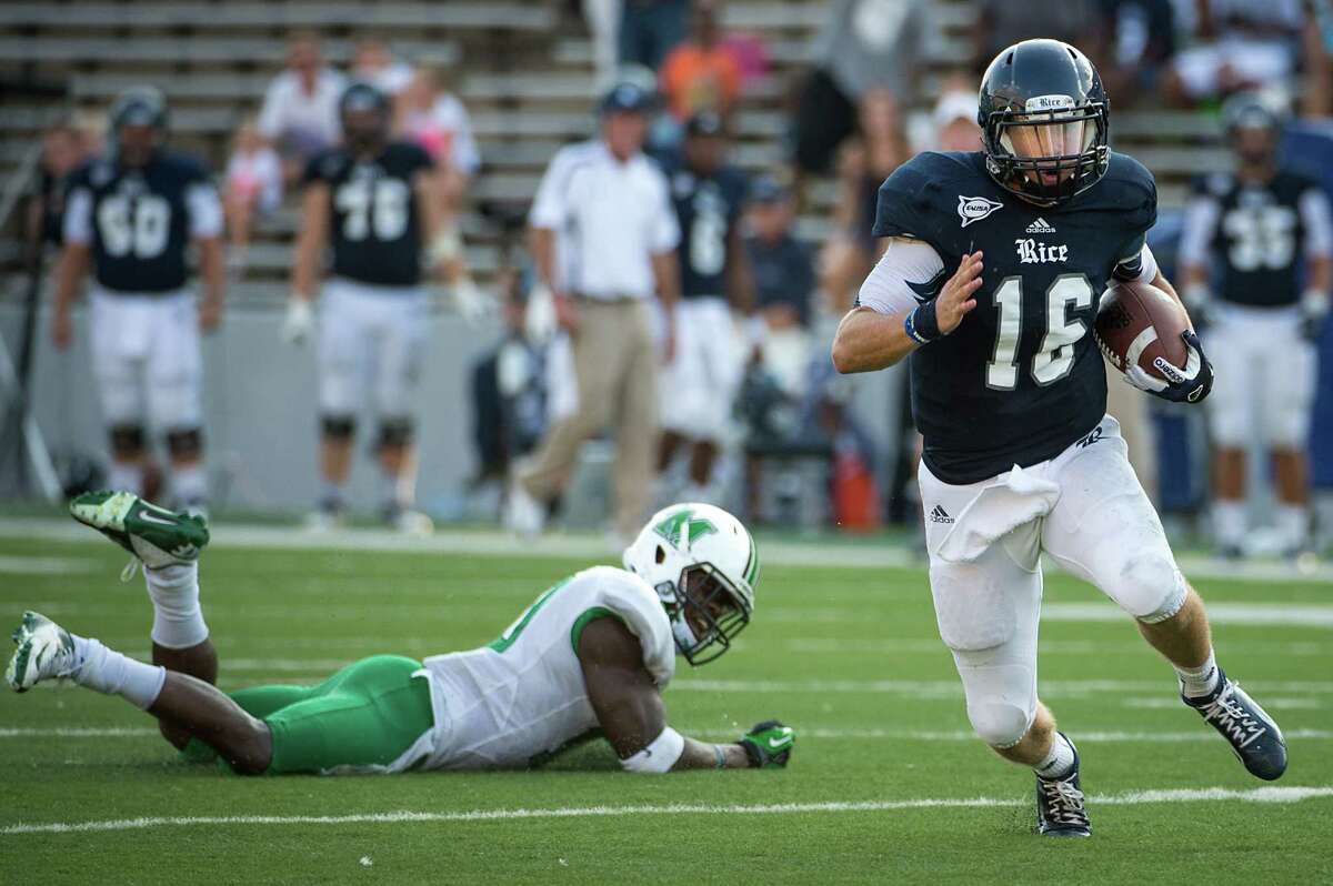 Rice quarterback Taylor McHargue (16) races past Marshall safety Okechukwu Okoroha on a 43-yard touchdown run during the fourth quarter of a college football game at Rice Stadium, Saturday, Sept. 22, 2012, in Houston.